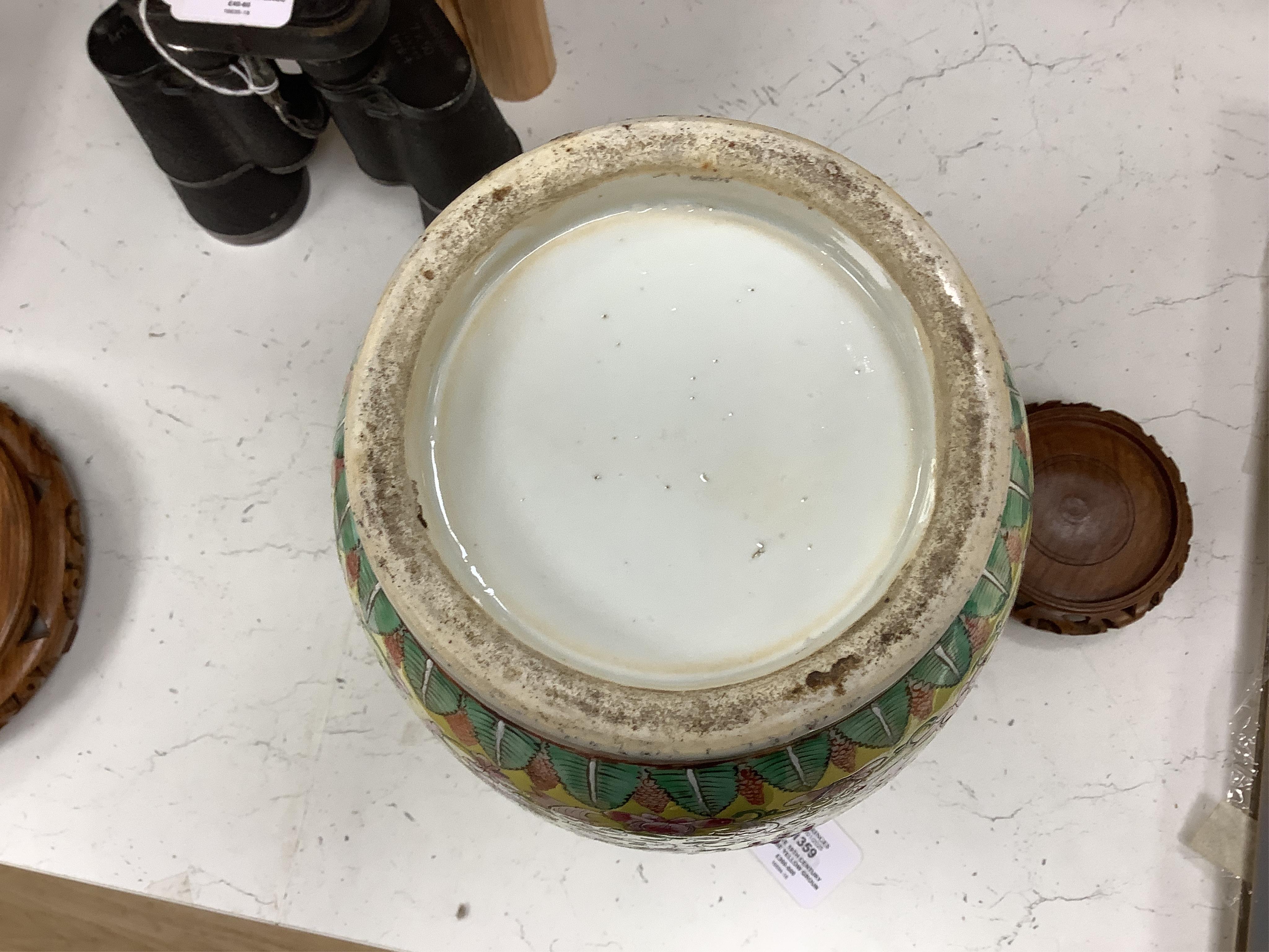 A late 19th century Chinese yellow ground porcelain vase, with gilt chilong handle, decorated with flowers and tendrils, iron red bands to the scalloped neck (including two stands), 35cm high. Condition - chip to top edg